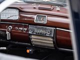 a car dashboard with a clock and a radio in it
