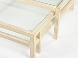 two tables with glass tops on a white surface