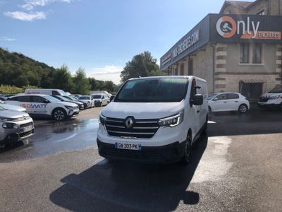 a white van parked in front of a building in a parking lot