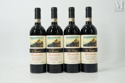 four bottles of wine are lined up on a white surface