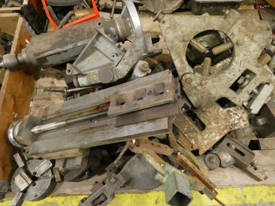 a pile of old tools sitting on top of a table
