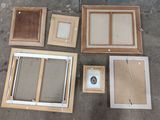 many different types of wood frames on the ground