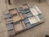 a pile of old wooden boxes sitting on the ground