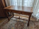 a wooden table with a drawer on top of it