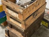 a wooden crate filled with assorted items in a garage