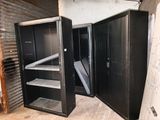 two black metal cabinets in a room that is being remodeled