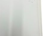a white book with a picture of a cat on it