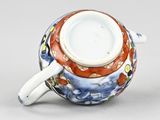 an image of a cup and saucer on a table