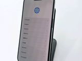 the back of a phone with a display on it on a white surface