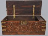 an old wooden chest with brass hardware on it
