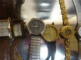 many different types of watches on display in a display case