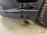 a close up of a car ' s bumper with a sticker on it