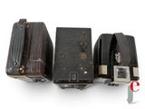 three pieces of luggage sitting next to each other on a white surface