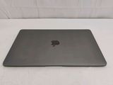 an apple macbook pro laptop sitting on top of a white surface