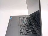 a laptop that is open on a white surface