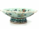 a small bowl that is sitting on a white surface