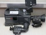 a camera that is sitting on a table next to a video camera