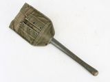 an old spatula with a metal handle on a white surface
