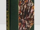 a green book with a picture of a group of people on it