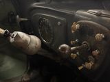 a dirty dashboard of a truck with a steering wheel