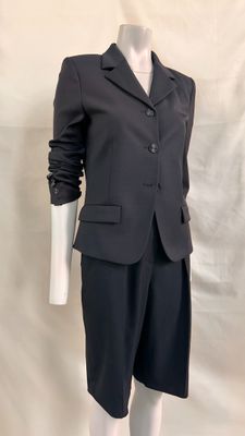 the mannequin is wearing a black suit and black shorts