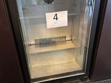 a small refrigerator that has a number 4 on it