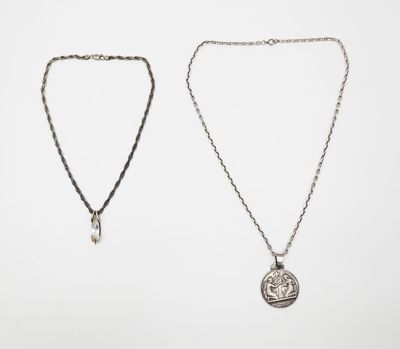 two silver necklaces on a white background
