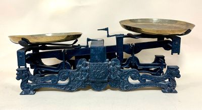 a blue scale that has two bowls on top of it