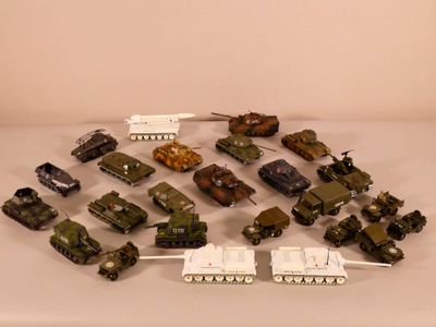 a lot of toy army vehicles on a table