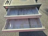 three drawers that are open on the ground