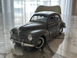 a toy car that is sitting on a marble floor