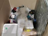 a cardboard box with a laptop and other items in it