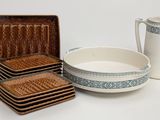 a lot of plates and bowls that are sitting on a table