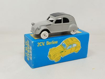 a toy car sitting on top of a blue box