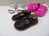 three pairs of shoes that are on a table