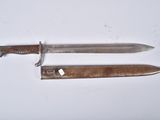two knives that are laying on a white surface