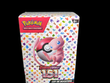 a box of pokemon cards on a black background
