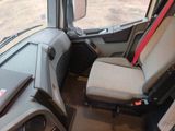 a seat in the back of a truck with a red seat belt