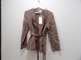a jacket hanging on a hanger on a wall