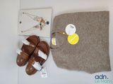 a bag, a pair of sandals, a necklace, and a pair of earrings