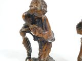 pair of antique wooden figurines of a man and a woman