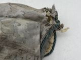 a bag that has a rope on it on the ground