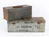 two old metal boxes sitting on top of each other
