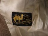 a close up of a camel on the back of a bag
