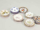 a lot of plates that are sitting on a table