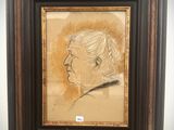 tableau représentant un homme de profil, dans un cadre marron accroché au mur