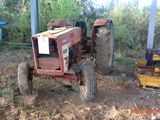 a tractor that is sitting in the dirt