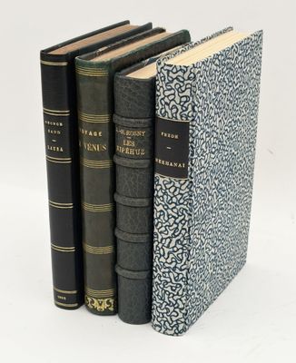 three books sitting on top of each other on a white surface