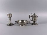 three silver plated items including a cup, saucer and a bowl