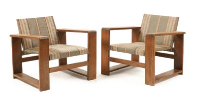 pair of wooden chairs with upholstered upholstered cushions